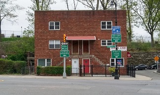 Two story brick building on street corner