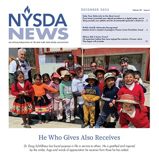 Small children gathered around grey haired man